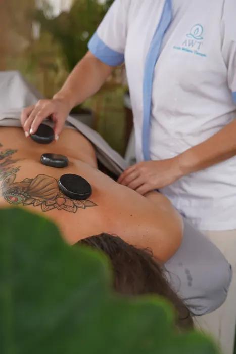 Hot stone massage treatment at AWT Spa, EVA Resort in Savaneta, Aruba